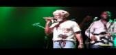 Michael plays with Reggae artist Burning Spear
